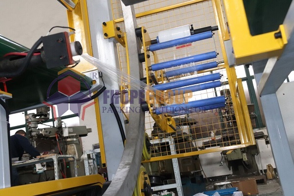 Orbital stretch wrapper tension control